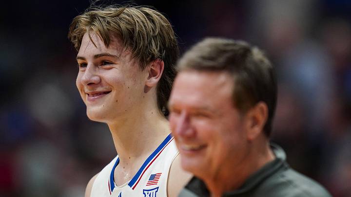 Nov 10, 2023; Lawrence, Kansas, USA; Kansas Jayhawks guard Johnny Furphy (10) and head coach Bill Self react during the second half against the Manhattan Jaspers at Allen Fieldhouse. Mandatory Credit: Jay Biggerstaff-Imagn Images