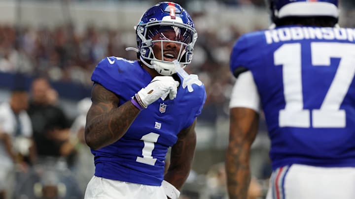 Sep 14, 2025; Arlington, Texas, USA; New York Giants wide receiver Malik Nabers (1) celebrates after scoring a touchdown against the Dallas Cowboys