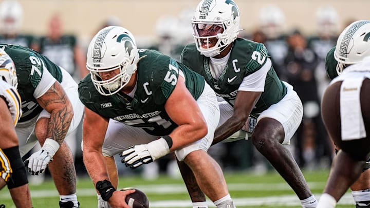 Michigan State quarterback Aidan Chiles (2) calls for a snap from offensive lineman Matt Gulbin (51) against Western Michigan during the first half at Spartan Stadium in East Lansing on Friday, August 29, 2025.