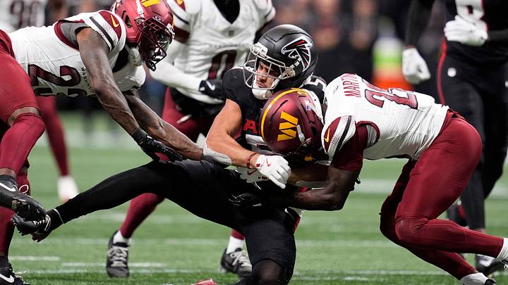 Sep 28, 2025; Atlanta, Georgia, USA; Atlanta Falcons wide receiver Drake London (5) is tackled by Washington Commanders cornerback Trey Amos (23) and safety Quan Martin (20) during the first half at Mercedes-Benz Stadium. Mandatory Credit: Dale Zanine-Imagn Images Sep 28, 2025; Atlanta, Georgia, USA; Atlanta Falcons wide receiver Drake London (5) is tackled by Washington Commanders cornerback Trey Amos (23) and safety Quan Martin (20) during the first half at Mercedes-Benz Stadium. Mandatory Credit: Dale Zanine-Imagn Images