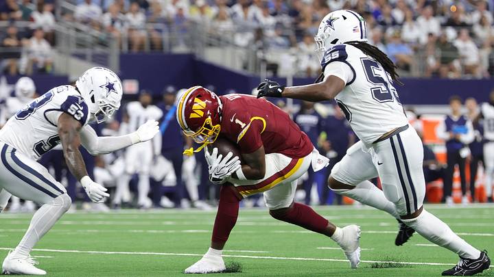 Washington Commanders running back Rachaad White (1) runs the ball against Dallas Cowboys linebackers Jaishawn Barham (55) and Dee Winters (53) during the first half at AT&T Stadium. Washington Commanders running back Rachaad White (1) runs the ball against Dallas Cowboys linebackers Jaishawn Barham (55) and Dee Winters (53) during the first half at AT&T Stadium.