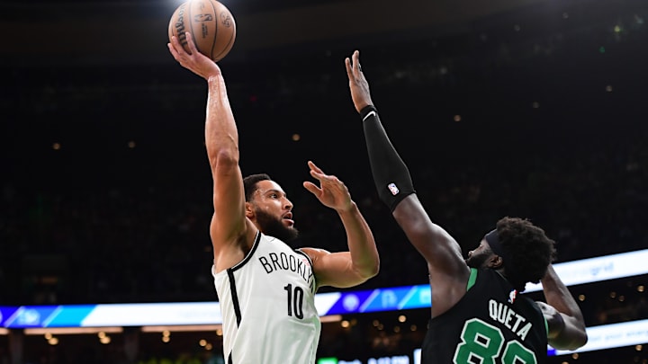 Nov 8, 2024; Boston, Massachusetts, USA;  Brooklyn Nets guard Ben Simmons (10) shoots the ball over Boston Celtics center Neemias Queta (88) during the first half at TD Garden. Mandatory Credit: Bob DeChiara-Imagn Images