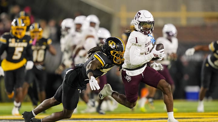 Nov 8, 2025; Columbia, Missouri, USA; Texas A&M Aggies wide receiver Mario Craver (1) runs with the ball against Missouri Tigers cornerback Toriano Pride Jr. (2) during the second half at Faurot Field at Memorial Stadium. Mandatory Credit: Jay Biggerstaff-Imagn Images Nov 8, 2025; Columbia, Missouri, USA; Texas A&M Aggies wide receiver Mario Craver (1) runs with the ball against Missouri Tigers cornerback Toriano Pride Jr. (2) during the second half at Faurot Field at Memorial Stadium. Mandatory Credit: Jay Biggerstaff-Imagn Images
