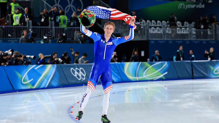 Feb 11, 2026; Milan, Italy; Jordan Stolz of the United States celebrates winning gold in men's speed skating 1000m during the Milano Cortina 2026 Olympic Winter Games at Milano Speed Skating Stadium. Mandatory Credit: Katie Stratman-Imagn Images