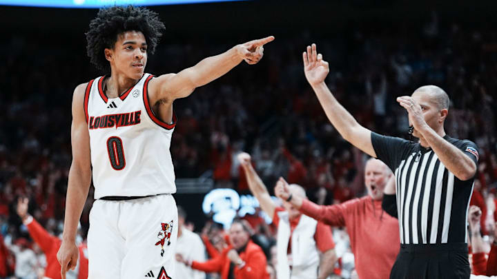 Louisville Cardinals guard Mikel Brown Jr. (0) celebrates his three-point shot as the Cards go up over Kentucky in the first half during the UofL-UK annual rivalry game at the KFC Yum! Center in Louisville, Kentucky Nov. 11, 2025.