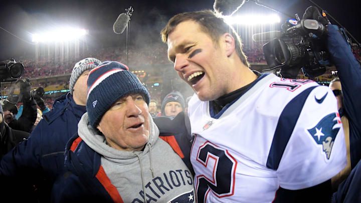 Jan 20, 2019; Kansas City, MO, USA; New England Patriots head coach Bill Belichick and quarterback Tom Brady (12) celebrate the win over the Kansas City Chiefs during overtime in the AFC Championship game at Arrowhead Stadium.