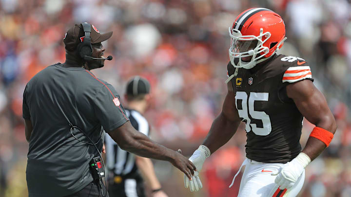 Cleveland Browns defensive line coach Jacques Cesaire, left, celebrates with defensive end Myles Garrett (95) during the first half of an NFL football game at Huntington Bank Field, Sunday, Sept. 22, 2024, in Cleveland, Ohio.