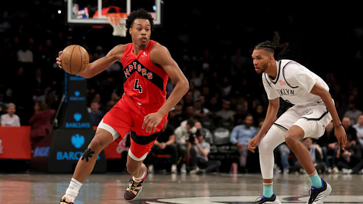 Mar 26, 2025; Brooklyn, New York, USA; Toronto Raptors forward Scottie Barnes (4) drives to the basket against Brooklyn Nets forward Ziaire Williams (8) during the fourth quarter at Barclays Center. Mandatory Credit: Brad Penner-Imagn Images