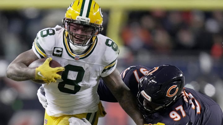 Green Bay Packers running back Josh Jacobs (8) is tackled by Chicago Bears defensive tackle Andrew Billings (97) during the second quarter of their wild card playoff game Saturday, January 10, 2026 at Soldier Field in Chicago, Illinois.