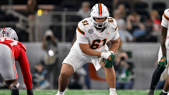 Dec 31, 2025; Arlington, TX, USA; Miami Hurricanes offensive lineman Francis Mauigoa (61) gets into position during the 2025 Cotton Bowl and quarterfinal game of the College Football Playoff at AT&T Stadium. Mandatory Credit: Jerome Miron-Imagn Images