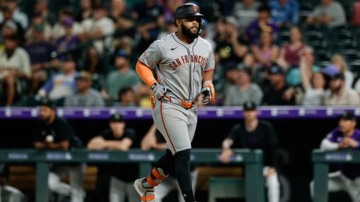 Jun 10, 2025; Denver, Colorado, USA; San Francisco Giants left fielder Heliot Ramos (17) runs to the dugout after a sacrifice fly RBI in the ninth inning against the Colorado Rockies at Coors Field. Mandatory Credit: Isaiah J. Downing-Imagn Images