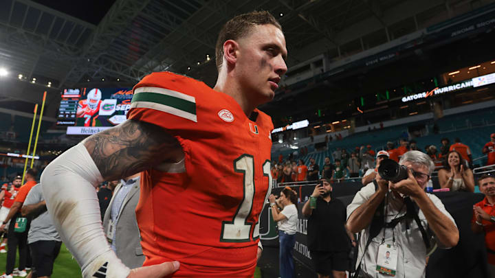 Sep 13, 2025; Miami Gardens, Florida, USA; Miami Hurricanes quarterback Carson Beck (11) walks off the field after the game against the South Florida Bulls at Hard Rock Stadium. Mandatory Credit: Sam Navarro-Imagn Images