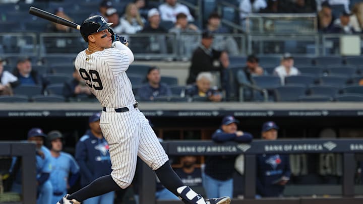 Bronx, New York, USA; New York Yankees right fielder Aaron Judge (99) hits a solo home run during the sixth inning against the Toronto Blue Jays at Yankee Stadium.