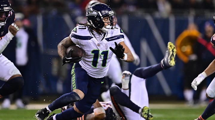 Dec 26, 2024; Chicago, Illinois, USA; Seattle Seahawks wide receiver Jaxon Smith-Njigba (11) runs after a catch against the Chicago Bears during the third quarter at Soldier Field. Mandatory Credit: Daniel Bartel-Imagn Images