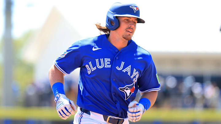 Mar 18, 2026; Dunedin, Florida, USA;  Toronto Blue Jays right fielder Addison Barger (47) hits a home run during the second inning against the Baltimore Orioles at TD Ballpark. 