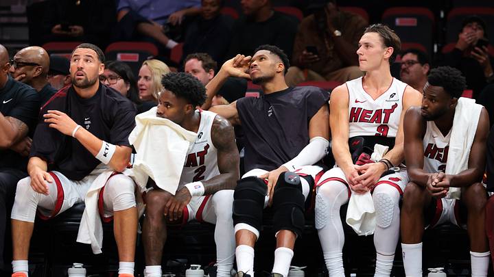 Oct 21, 2026; Miami, Florida, USA; Miami Heat guard Klay Thompson (11), guard Davion Mitchell (2), forward Giannis Antetokounmpo (7), guard Pelle Larsson (9) and forward Andrew Wiggins (22) look on from the bench against the Minnesota Timberwolves during the fourth quarter at Kaseya Center. Mandatory Credit: Sam Navarro-Imagn Images Oct 21, 2026; Miami, Florida, USA; Miami Heat guard Klay Thompson (11), guard Davion Mitchell (2), forward Giannis Antetokounmpo (7), guard Pelle Larsson (9) and forward Andrew Wiggins (22) look on from the bench against the Minnesota Timberwolves during the fourth quarter at Kaseya Center. Mandatory Credit: Sam Navarro-Imagn Images