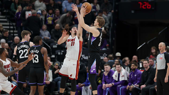 Jan 9, 2025; Salt Lake City, Utah, USA;  Utah Jazz forward Lauri Markkanen (23) shoots the ball over Miami Heat guard Jaime Jaquez Jr. (11) during the first quarter at Delta Center. Mandatory Credit: Chris Nicoll-Imagn Images
