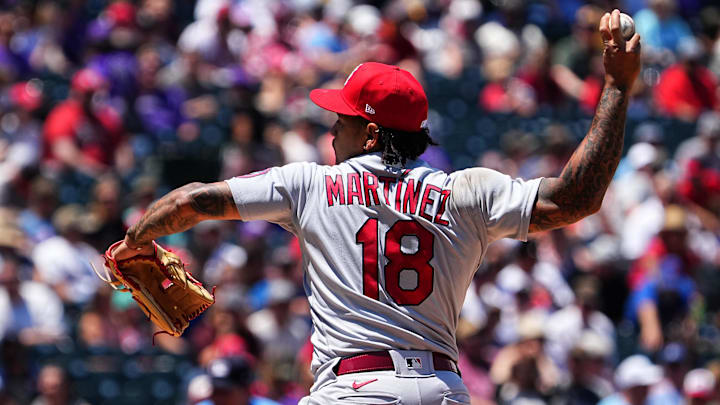 Jul 4, 2021; Denver, Colorado, USA; St. Louis Cardinals starting pitcher Carlos Martinez (18) delivers a pitch in the second inning against the Colorado Rockies at Coors Field. Mandatory Credit: Ron Chenoy-Imagn Images