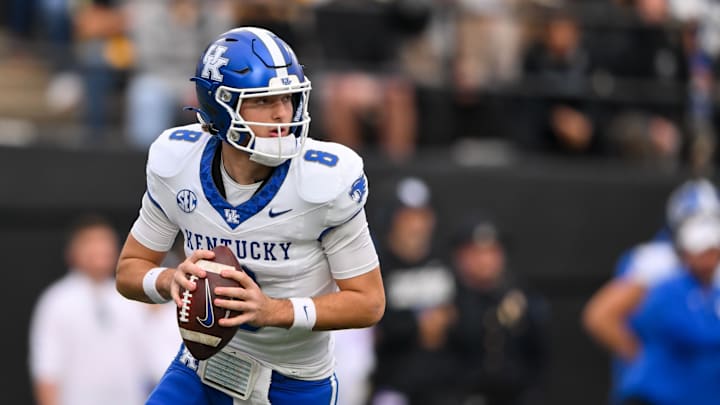 Nov 22, 2025; Nashville, Tennessee, USA;  Kentucky Wildcats quarterback Cutter Boley (8) scrambles against the Vanderbilt Commodores during the first half at FirstBank Stadium. Mandatory Credit: Steve Roberts-Imagn Images