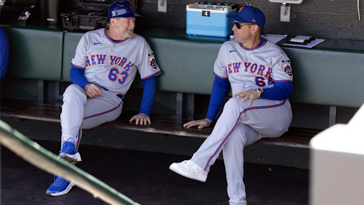 New York Mets third base coach Tim Leiper and manager Carlos Mendoza.