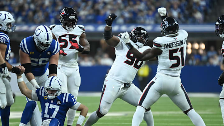 Nov 30, 2025; Indianapolis, Indiana, USA; Houston Texans defensive tackle Sheldon Rankins (90) and Houston Texans defensive end Will Anderson Jr. (51) celebrate after sacking Indianapolis Colts quarterback Daniel Jones (17) during the first half at Lucas Oil Stadium. Mandatory Credit: Robert Goddin-Imagn Images