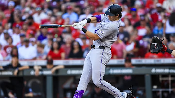 Jul 11, 2025; Cincinnati, Ohio, USA; Colorado Rockies first baseman Michael Toglia (4) bats against the Cincinnati Reds in the second inning at Great American Ball Park. 