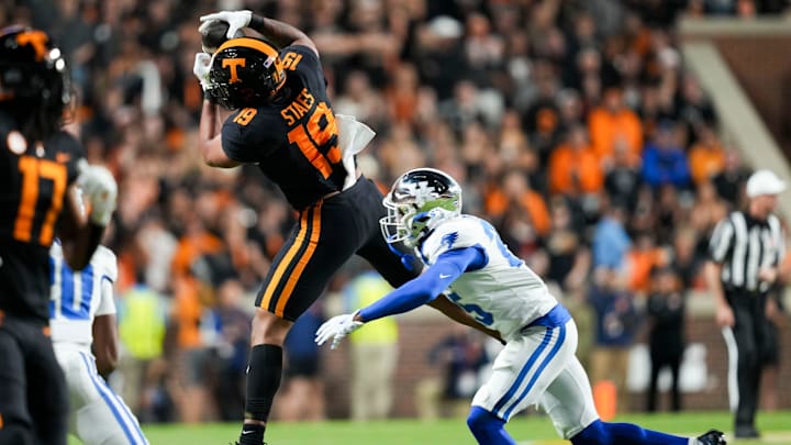 Tennessee tight end Holden Staes (19) with the catch over Kentucky defensive back Jordan Lovett (25) during an NCAA college football game between Tennessee and Kentucky on Saturday, Nov. 2, 2024, in Knoxville, Tenn.