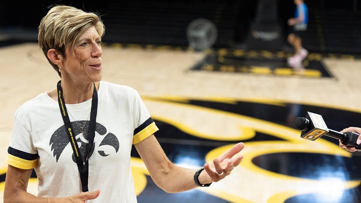 Iowa head coach Jan Jensen talks to reporters after practice June 25, 2026 at Carver-Hawkeye Arena in Iowa City, Iowa.