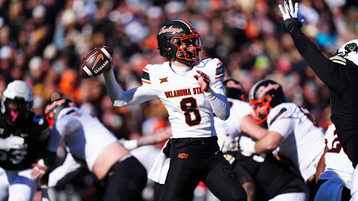 Nov 29, 2024; Boulder, Colorado, USA; Oklahoma State Cowboys quarterback Maealiuaki Smith (8 prepares to pass the ball in the second quarter against the Colorado Buffaloes at Folsom Field. Mandatory Credit: Ron Chenoy-Imagn Images Nov 29, 2024; Boulder, Colorado, USA; Oklahoma State Cowboys quarterback Maealiuaki Smith (8 prepares to pass the ball in the second quarter against the Colorado Buffaloes at Folsom Field. Mandatory Credit: Ron Chenoy-Imagn Images