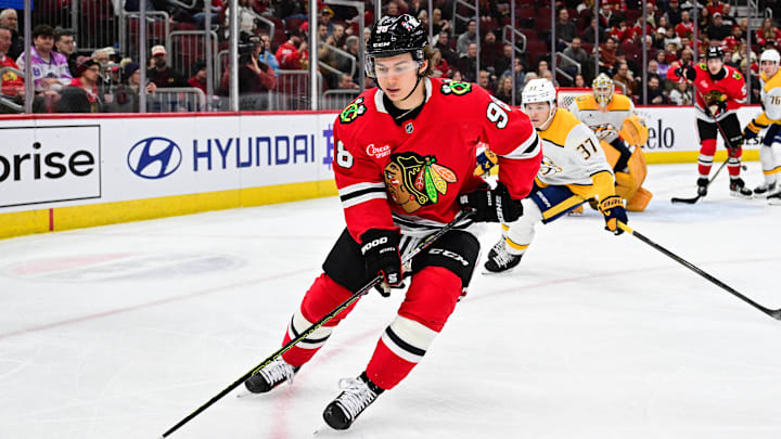 Feb 7, 2025; Chicago, Illinois, USA; Chicago Blackhawks center Connor Bedard (98) skates with the puck against the Nashville Predators during the third period at the United Center. Mandatory Credit: Daniel Bartel-Imagn Images