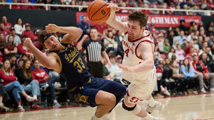 Dec 30, 2025; Stanford, California, USA; Stanford Cardinal forward AJ Rohosy (4) drives to the basket against Notre Dame Fighting Irish forward Carson Towt (33) during the second half at Maples Pavilion. Mandatory Credit: Robert Edwards-Imagn Images