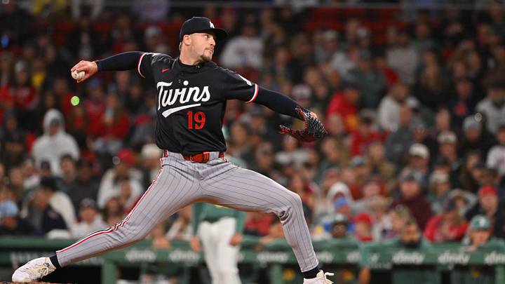May 22, 2026; Boston, Massachusetts, USA; Minnesota Twins relief pitcher Eric Orze (19) pitches against the Boston Red Sox during the eighth inning at Fenway Park. Mandatory Credit: Eric Canha-Imagn Images