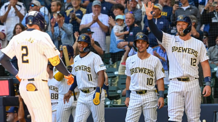 Jun 30, 2024; Milwaukee, Wisconsin, USA;  Milwaukee Brewers second baseman Brice Turang (2) is greeted by right fielder Jackson Chourio (11),  center fielder Sal Frelick (10) and designated hitter Rhys Hoskins (12) after hitting grand slam home run in the fourth inning against the Chicago Cubs at American Family Field.