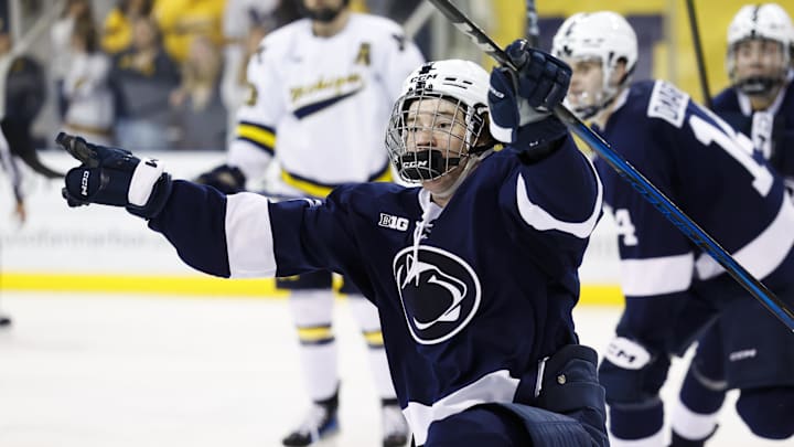 Mar 7, 2025; Ann Arbor, MI, USA;  Penn State forward JJ Wiebusch (20) celebrates his game winning goal in overtime against the michigan wolverines during a Big Ten Tournament quarter final game at Yost Arena. Mandatory Credit: Rick Osentoski-Imagn Images