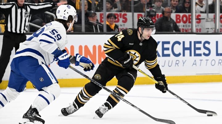 Apr 22, 2024; Boston, Massachusetts, USA; Boston Bruins left wing Jake DeBrusk (74) skates against Toronto Maple Leafs left wing Tyler Bertuzzi (59) during the first period in game two of the first round of the 2024 Stanley Cup Playoffs at TD Garden. Mandatory Credit: Brian Fluharty-USA TODAY Sports Apr 22, 2024; Boston, Massachusetts, USA; Boston Bruins left wing Jake DeBrusk (74) skates against Toronto Maple Leafs left wing Tyler Bertuzzi (59) during the first period in game two of the first round of the 2024 Stanley Cup Playoffs at TD Garden. Mandatory Credit: Brian Fluharty-USA TODAY Sports