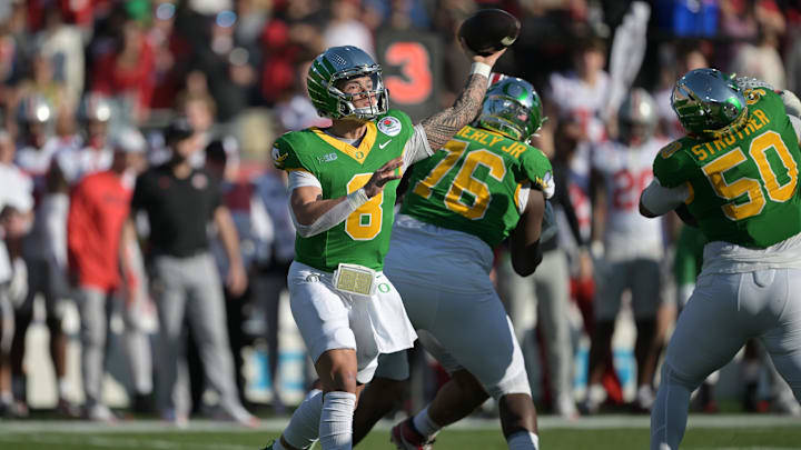 Jan 1, 2025; Pasadena, CA, USA; Oregon Ducks quarterback Dillon Gabriel (8) throws a pass in the first quarter against the Ohio State Buckeyes in the 2025 Rose Bowl college football quarterfinal game at Rose Bowl Stadium.