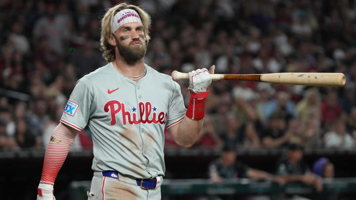 Aug 9, 2024; Phoenix, Arizona, USA; Philadelphia Phillies first base Bryce Harper (3) reacts after a high pitch in the ninth inning during a game against the Arizona Diamondbacks at Chase Field. Aug 9, 2024; Phoenix, Arizona, USA; Philadelphia Phillies first base Bryce Harper (3) reacts after a high pitch in the ninth inning during a game against the Arizona Diamondbacks at Chase Field.