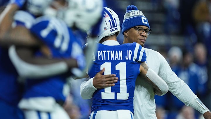 Indianapolis Colts quarterback Anthony Richardson (5) hugs Indianapolis Colts wide receiver Michael Pittman Jr. (11) on Sunday, Jan. 5, 2025, during pregame warm-up at Lucas Oil Stadium in Indianapolis.