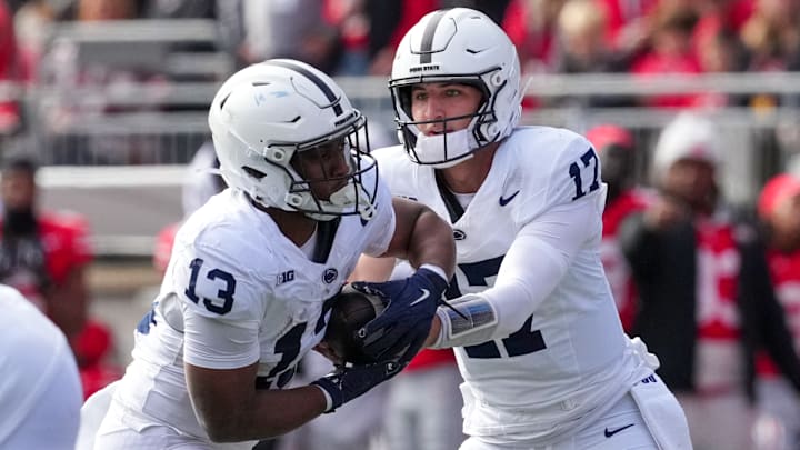 Penn State football quarterback Ethan Grunkemeyer handing the ball to running back Kaytron Allen in the first half against Ohio State