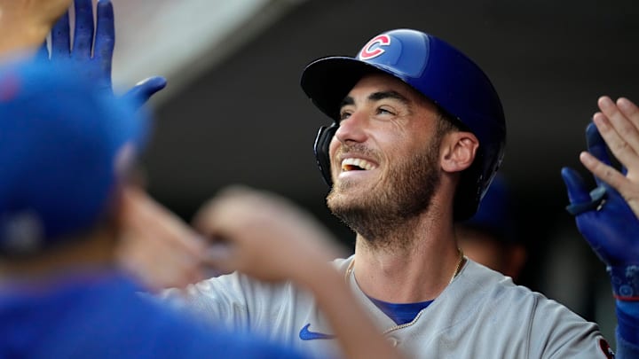 Chicago Cubs center fielder Cody Bellinger celebrates in the dugout after hitting a solo home run during a 2023 game against the Cincinnati Reds at Great American Ball Park.