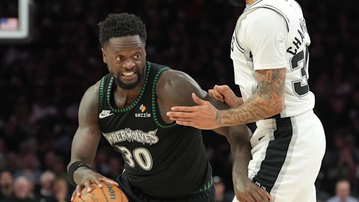 May 15, 2026; Minneapolis, Minnesota, USA; Minnesota Timberwolves forward Julius Randle (30) dribbles the ball past San Antonio Spurs forward Julian Champagnie (30) in the second half during game six of the second round of the 2026 NBA Playoffs at Target Center. Mandatory Credit: Jesse Johnson-Imagn Images