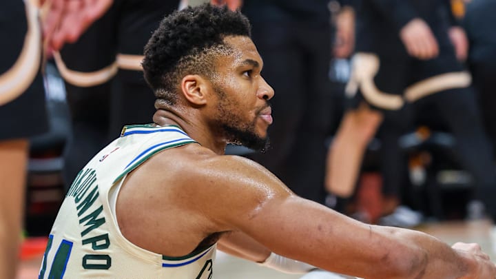 Jan 19, 2026; Atlanta, Georgia, USA; Milwaukee Bucks forward Giannis Antetokounmpo (34) sits on the ground after a collision against the Milwaukee Bucks during the fourth quarter at State Farm Arena. Mandatory Credit: Jordan Godfree-Imagn Images