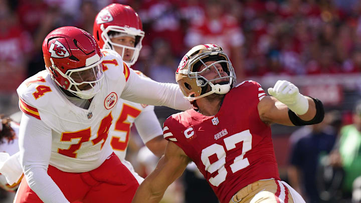 Oct 20, 2024; Santa Clara, California, USA; San Francisco 49ers defensive end Nick Bosa (97) looks up at the ball while being blocked by Kansas City Chiefs offensive tackle Jawaan Taylor (74) in the first quarter at Levi's Stadium. Mandatory Credit: Cary Edmondson-Imagn Images