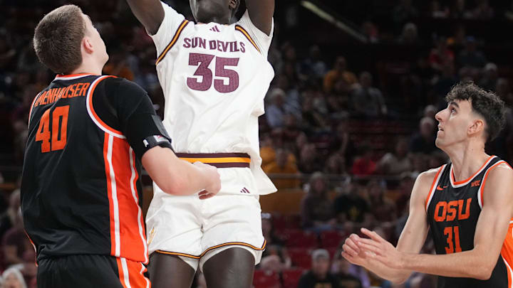 ASU Sun Devils center Massamba Diop (35) shoots the ball over Oregon State Beavers center Noah Amenhauser (40) at Desert Financial Arena in Tempe on Dec. 21, 2025.