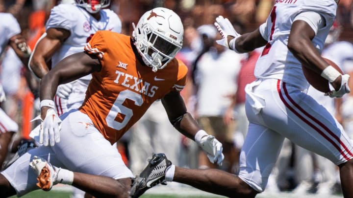 Texas defensive back Ryan Watts (6) chases Alabama's Kool-Aid McKinstry (1) as he runs with the ball during the second half of the Longhorns game against the Crimson Tide at Royal-Memorial Stadium in Austin on Saturday, Sept. 10, 2022. Alabama won the game 20-19 with a late field goal.