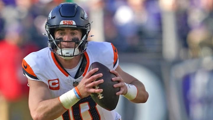 Nov 3, 2024; Baltimore, Maryland, USA; Denver Broncos quarterback Bo Nix (10) scrambles in the second quarter against the Baltimore Ravens at M&T Bank Stadium. 