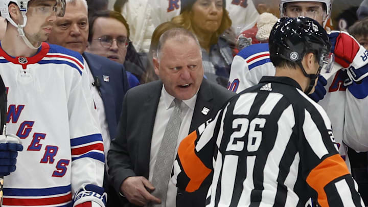 Feb 25, 2023; Washington, District of Columbia, USA; New York Rangers Gerard Gallant argues with referee Jacob Brenk (26) against the Washington Capitals in the first period at Capital One Arena. Mandatory Credit: Geoff Burke-Imagn Images