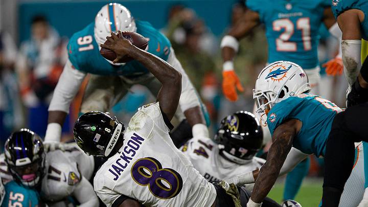 Baltimore Ravens quarterback Lamar Jackson (8), is sacked during fourth quarter action of their NFL game at Hard Rock Stadium Thursday in Miami Gardens.

Baltimore Ravens V Miami Dolphins 024