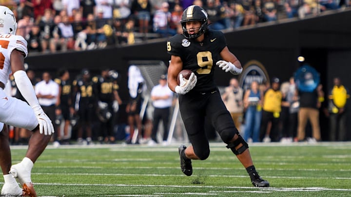 Oct 26, 2024; Nashville, Tennessee, USA;  Vanderbilt Commodores tight end Eli Stowers (9) runs the ball as Texas Longhorns defensive back Jelani McDonald (25) during the first half at FirstBank Stadium.