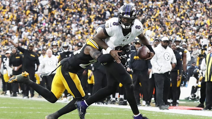 Pittsburgh Steelers cornerback Joey Porter Jr. (24) stops Baltimore Ravens quarterback Lamar Jackson (8) short of the end-zone on a two-point conversion attempt during the fourth quarter at Acrisure Stadium. 
